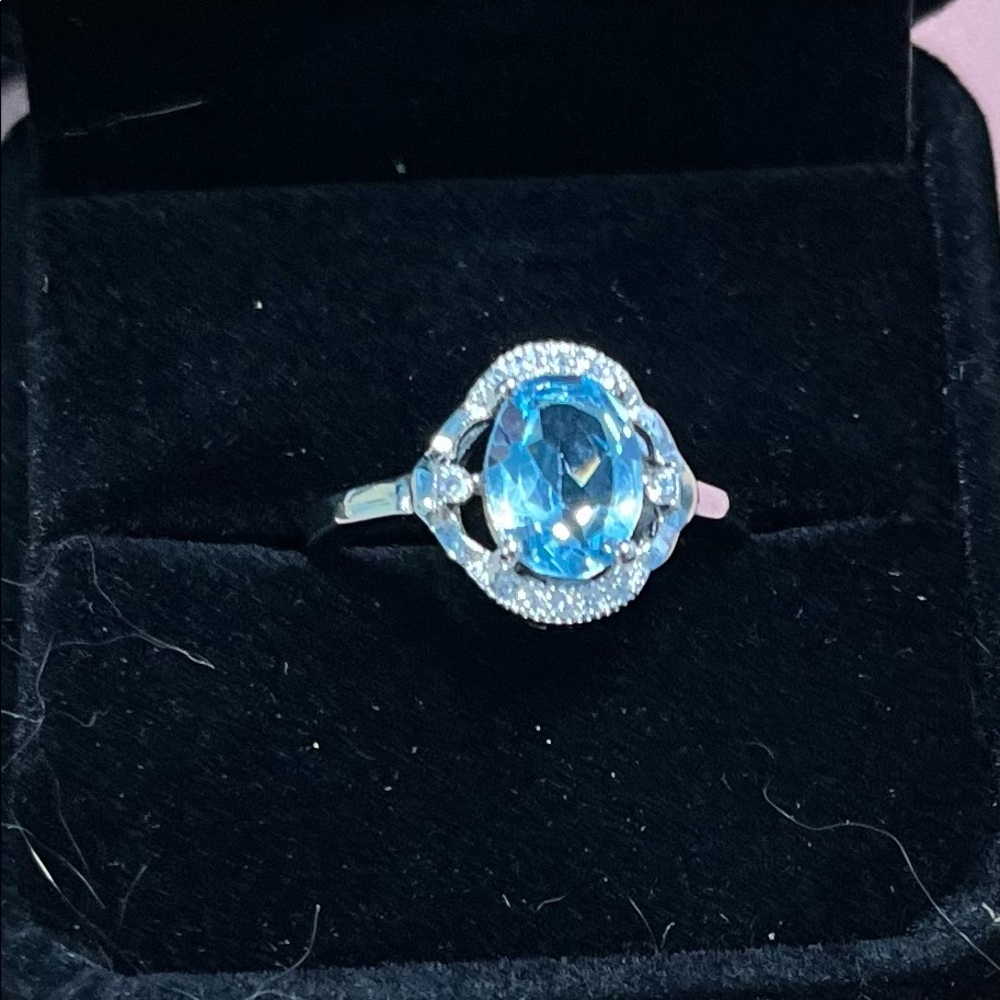 Blue oval topaz silver ring